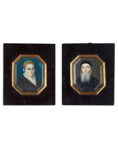 Pair of miniature portraits, evidently of an Orthodox husband and wife, very finely painted and encassed behind glass.