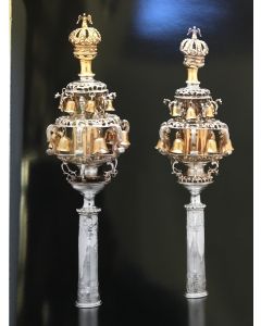 A PAIR OF RARE AND IMPORTANT GERMAN PARCEL-GILT SILVER TORAH FINIALS.