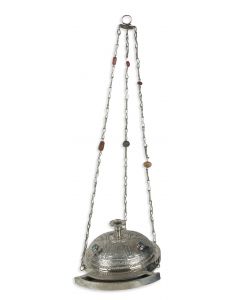 In the form of a Roman lamp embossed and etched with fluting, foliage and Hebrew inscriptions; suspended from three chains. Set and interspersed with real inlaid stones. Lacking removable candle rack. Height: 27 inches (68 cm).